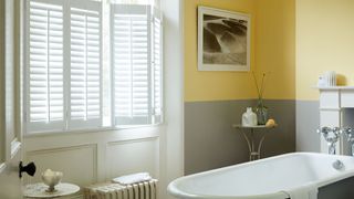 bathroom with shutters at the window