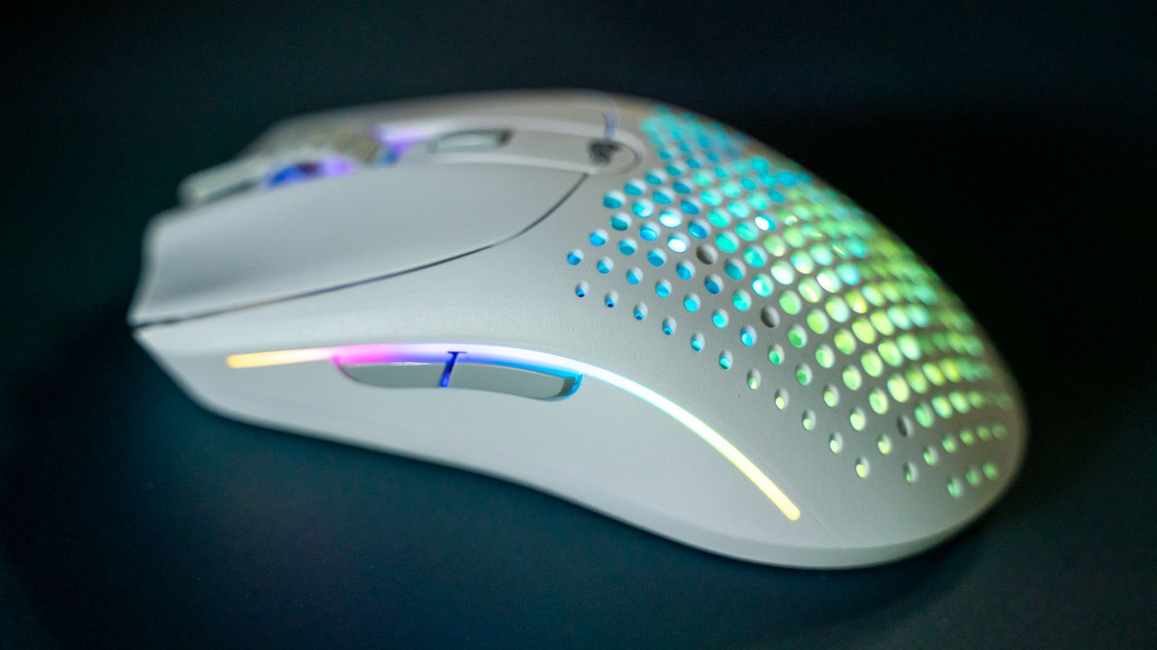 Glorious O2 Wireless on a dark blue desk pad