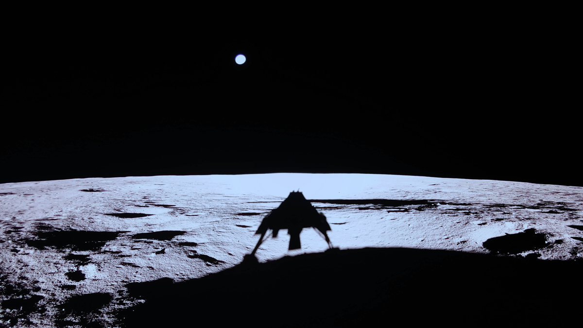 image of shadow of blue ghost lander on moon, with earth in the background.