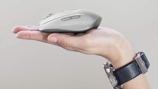 Hand holding Logitech MX Anywhere 3, one of the best Mac mice