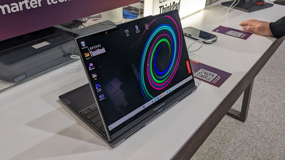 The Lenovo ThinkBook Plus Twist laptop on a display stand at the MWC 2023 event.
