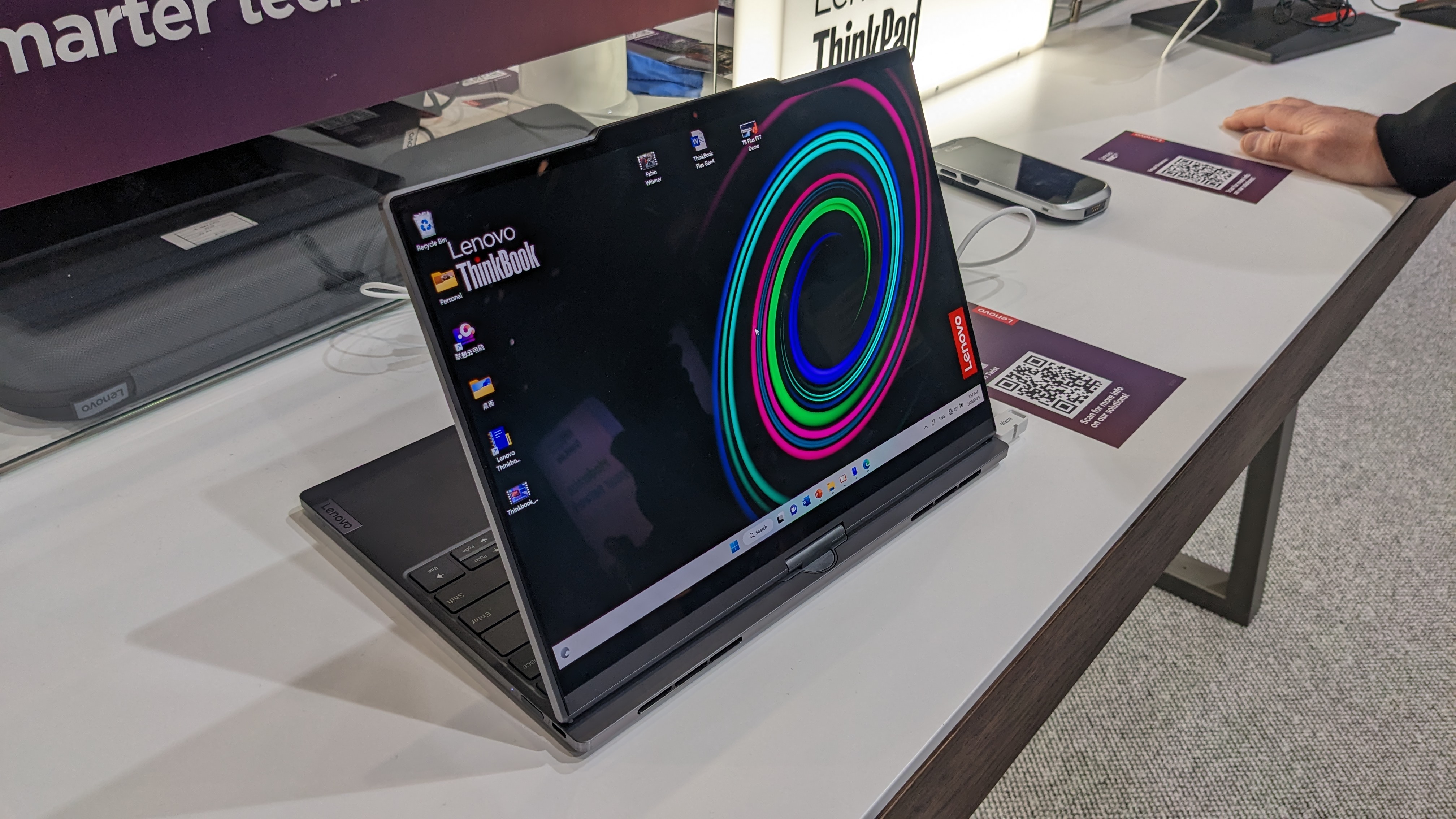 The Lenovo ThinkBook Plus Twist laptop on a display stand at the MWC 2023 event.