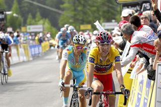 Janez Brajkovic (Team RadioShack) leads Alberto Contador (Astana) across the finish line.