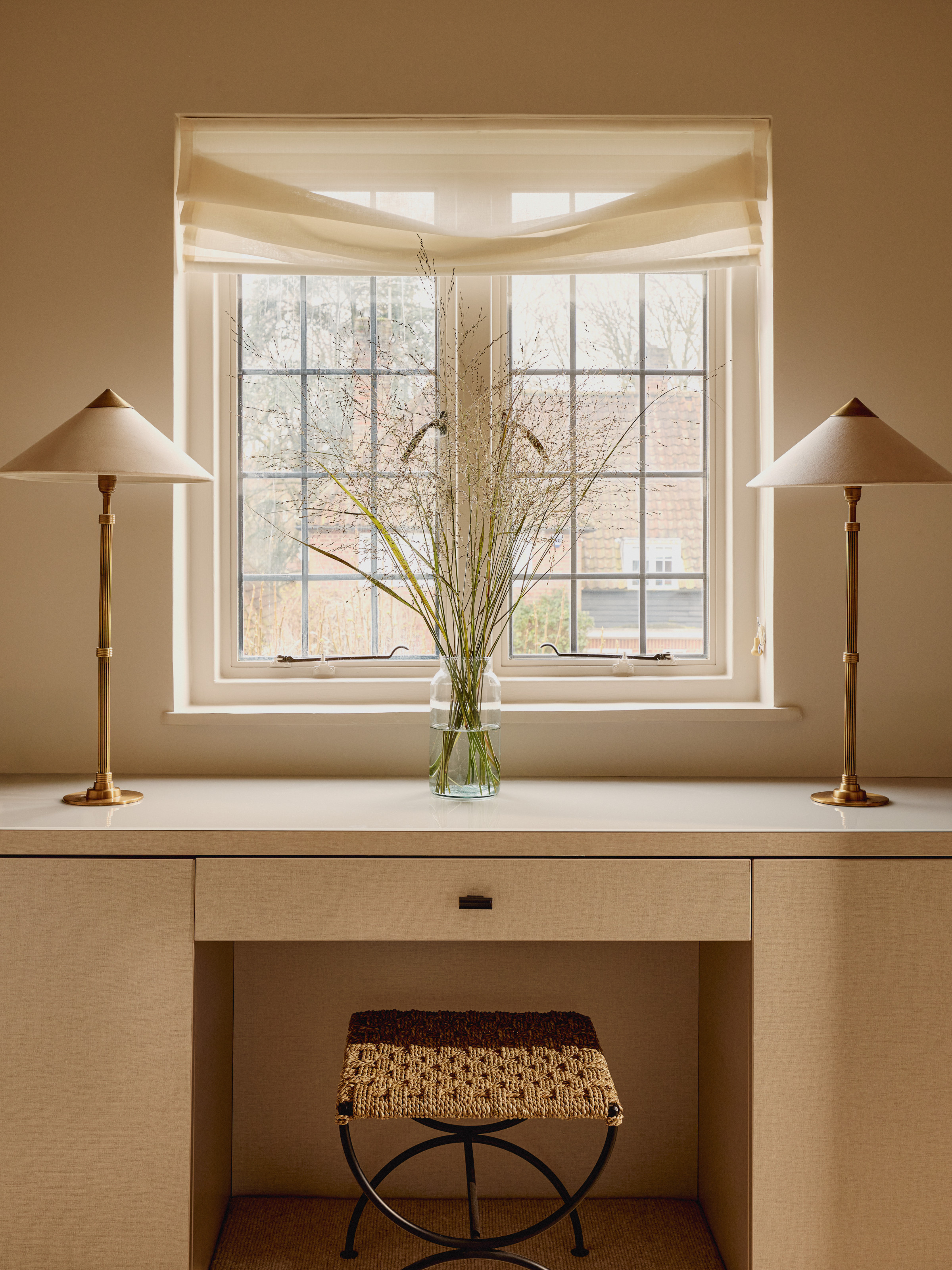 Cream dressing area with vanity and stool