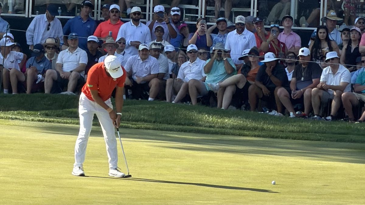 A golfer putting