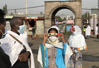 People observe annular solar eclipse with special goggles in Addis Ababa, Ethiopia on June 21, 2020.