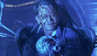 Sam Neill smiles with a severely shredded face in Event Horizon