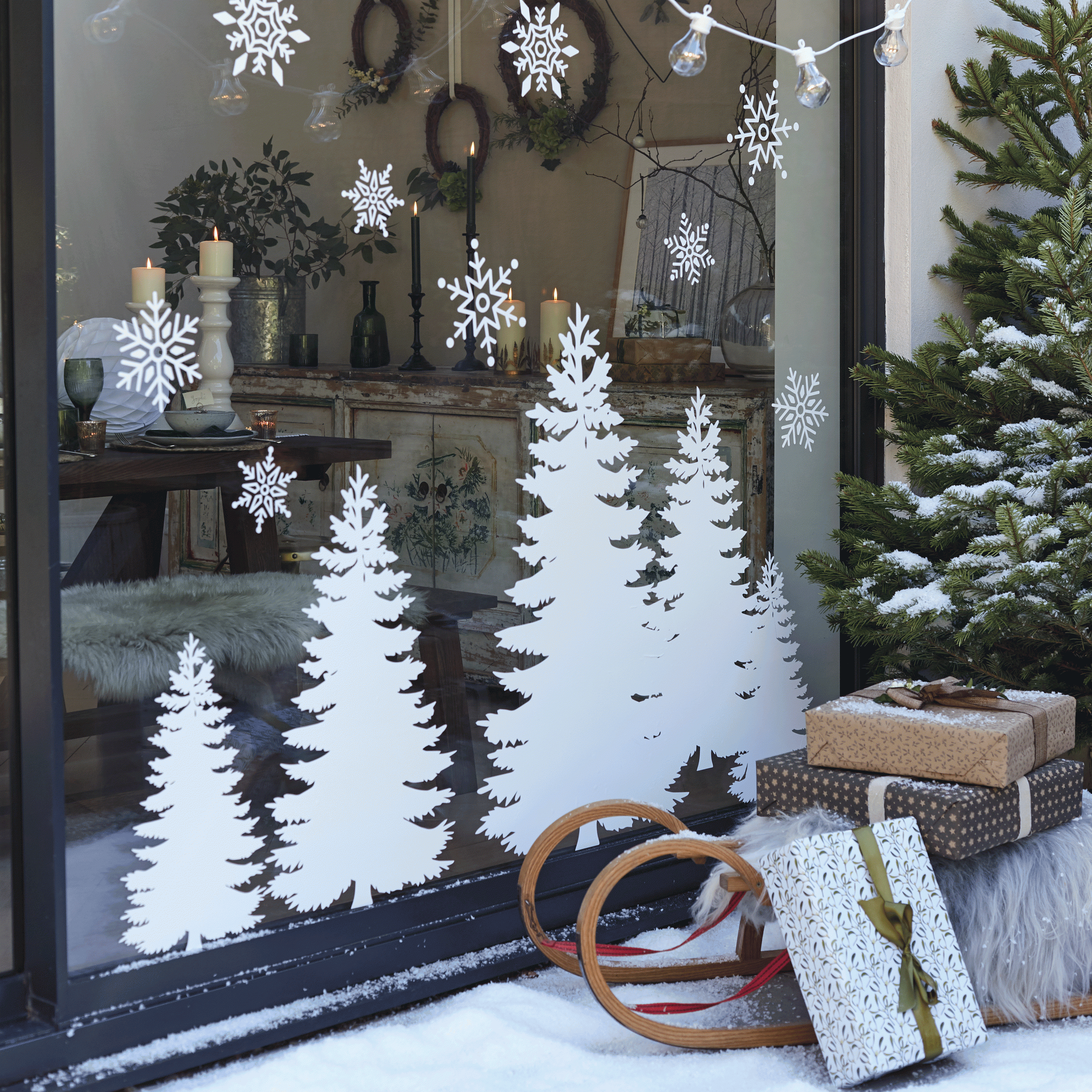 dining room with christmas window prints and tree