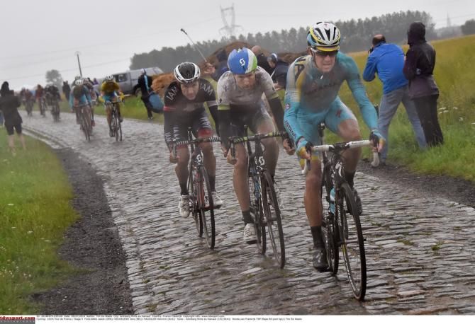 Jakob Fuglsang (Astana) followed by Jens Keukeleire (Orica-GreenEdge) and Heinrich Haussler (IAM Cycling)