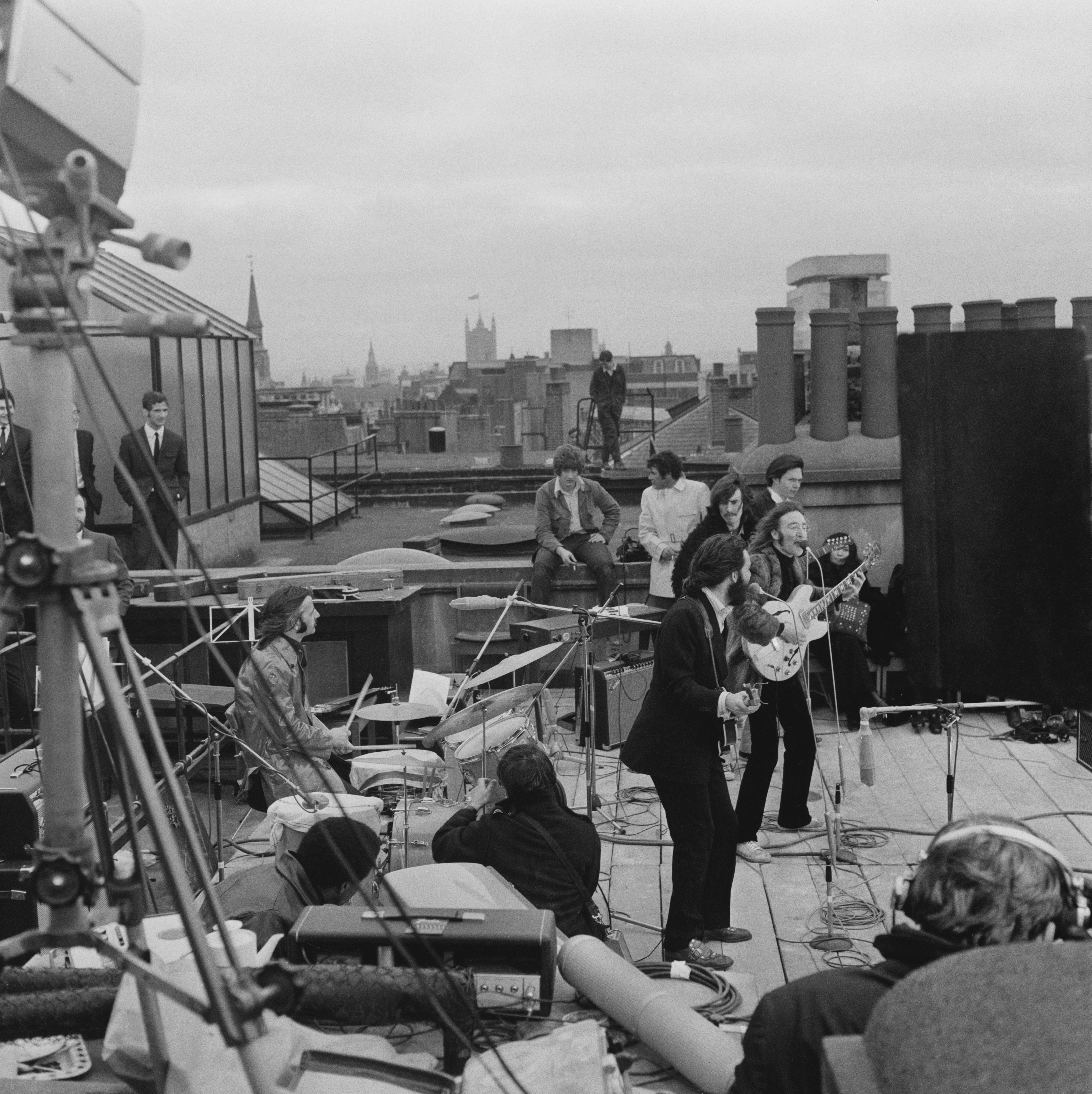British rock group the Beatles performing their last live public concert on the rooftop of the Apple Organization building for director Michael Lindsey-Hogg&#039;s film documentary, &#039;Let It Be,&#039; on Savile Row