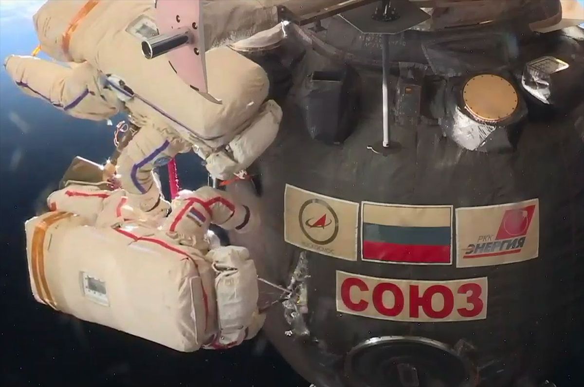 Cosmonauts On Spacewalk Cut Into Soyuz Spacecraft To Inspect Patched Hole Space