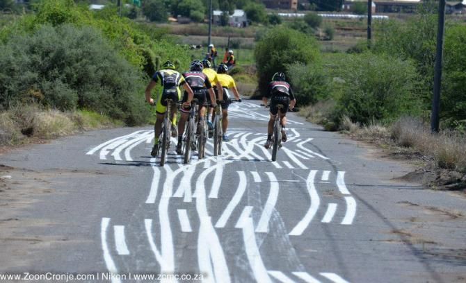The leading group comprising Team Bulls, Asrin Cycling and Konny Looser hit a piece of tar outside Oudtshoorn during the latter part of Stage 6