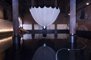 ... allows for viewers to catch the ghostly glow of the dress and reflected in the water