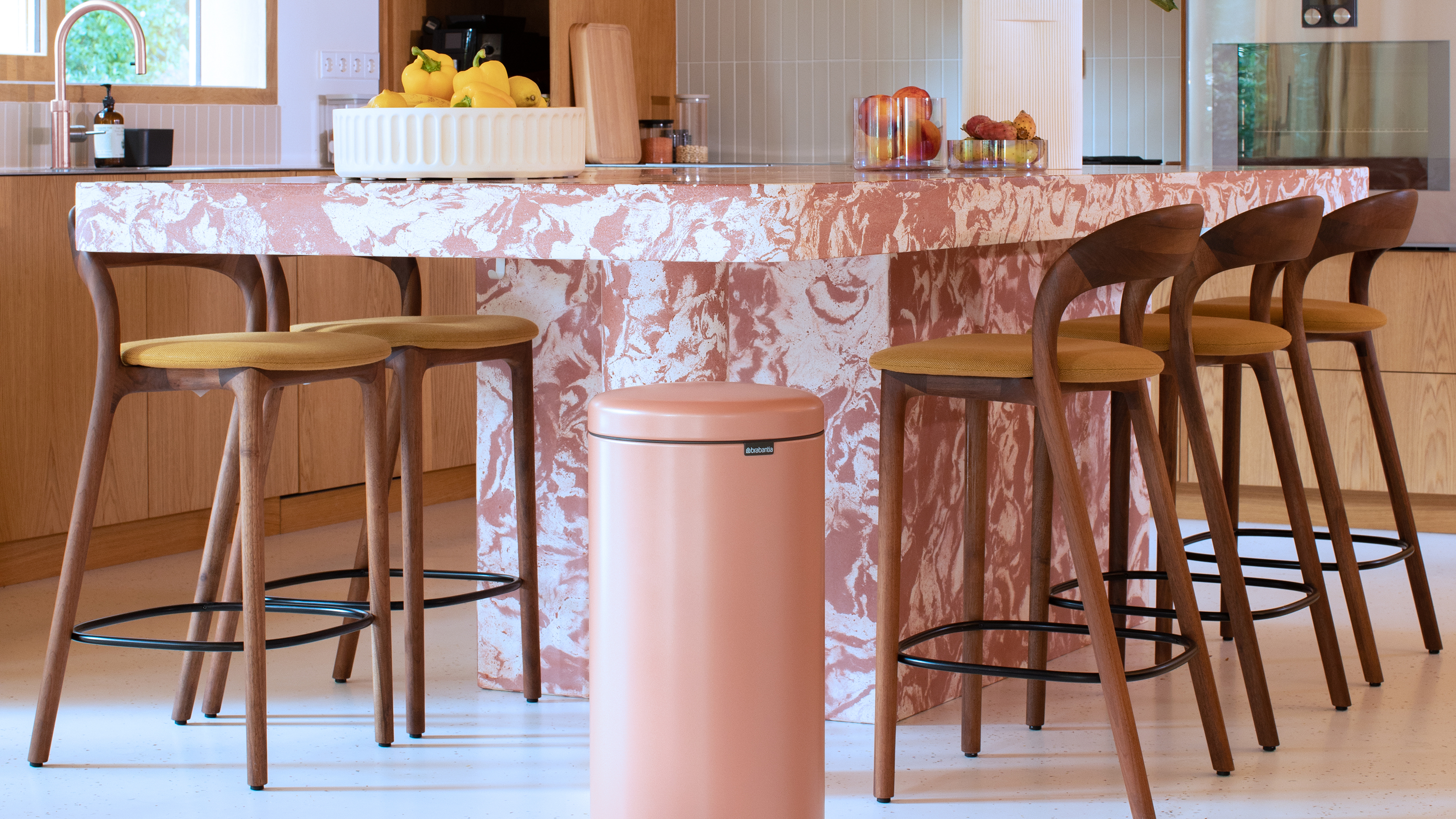 Brabantia pink bin next to pink stone island