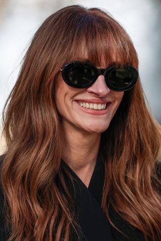 Julia Roberts has warm copper hair whilst at the Jacquemus Womenswear Ready-to-wear Spring-Summer 2024 collection at Maeght Foundation, in Saint-Paul-de-Vence, southern France, on January 29, 2024.