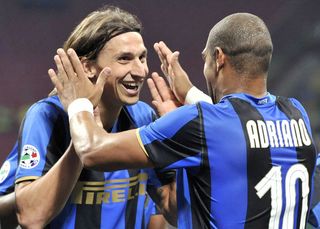 Inter Milan's Swedish forward Zlatan Ibrahimovic (L) celebrates with teammate, Brazilian forward Adriano after he scored against Bologna during their Italian Serie A match at San Siro Stadium in Milan, on October 4, 2008.