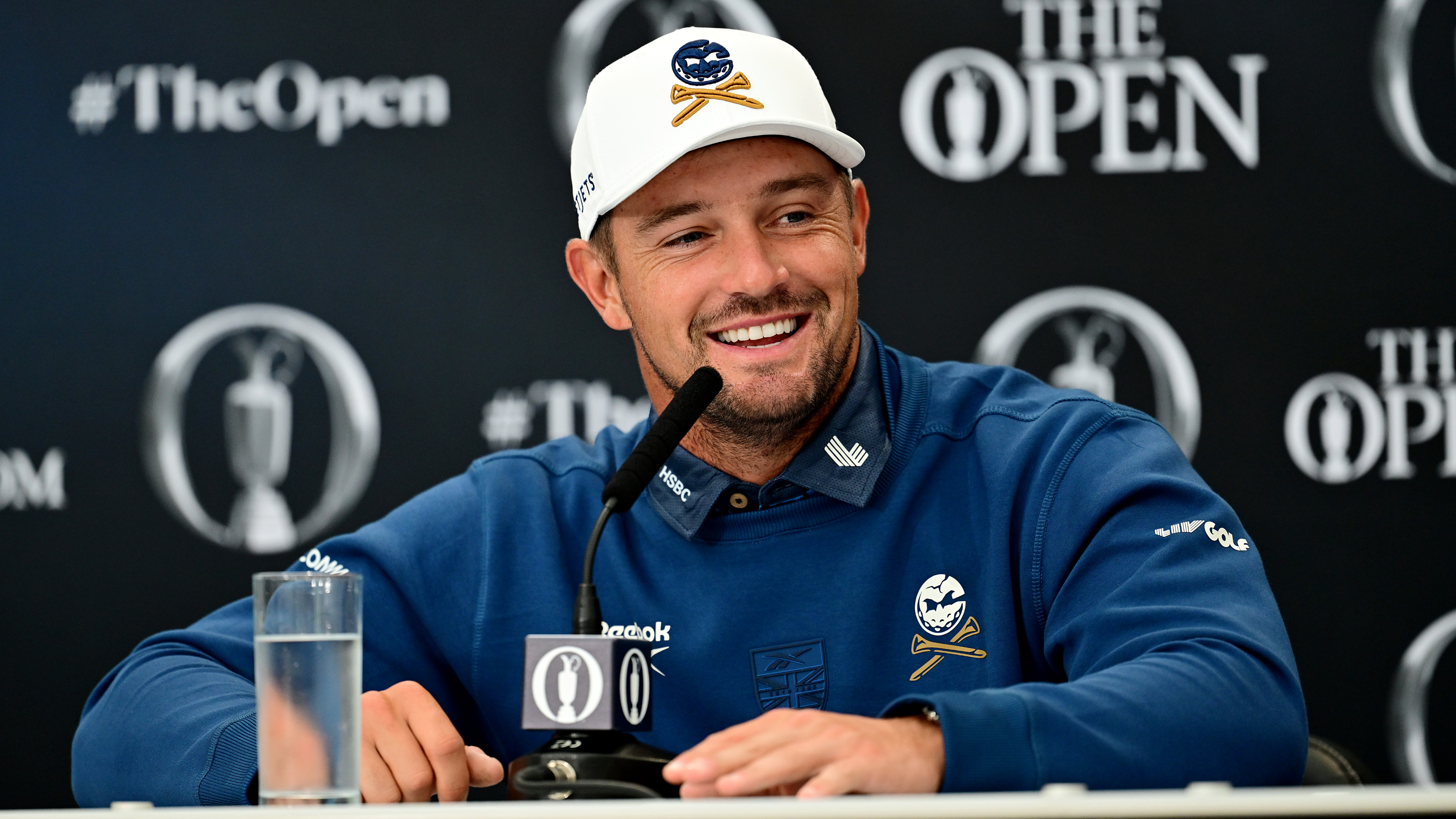 Bryson DeChambeau smiling at a press conference ahead of the 153rd Open at Royal Portrush