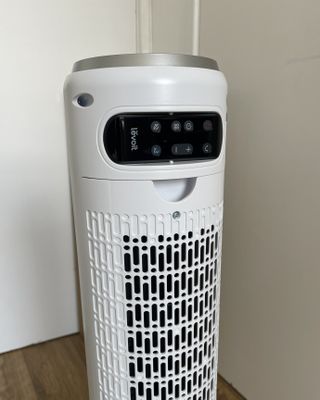 Levoit 36-Inch Classic Tower Fan's remote control, slotted behind the fan