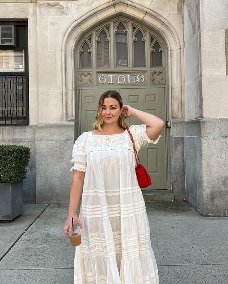 @oliviamarcus wearing a white embroidered dress