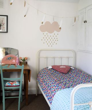 kids room with white bed and white walls