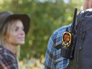 Midland walkie talkie on hiker