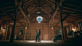 Mel and Jack dancing together in a barn in Virgin River season 6.