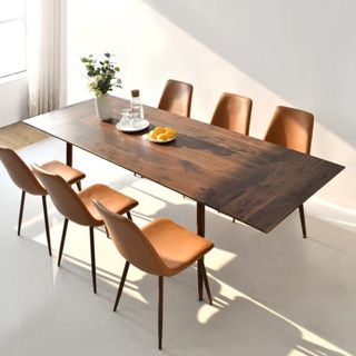 Wayfair Bende Extendable Dining Table and chairs against a white wall.