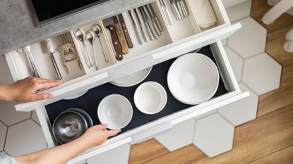 Kitchen drawer with cutlery and plates
