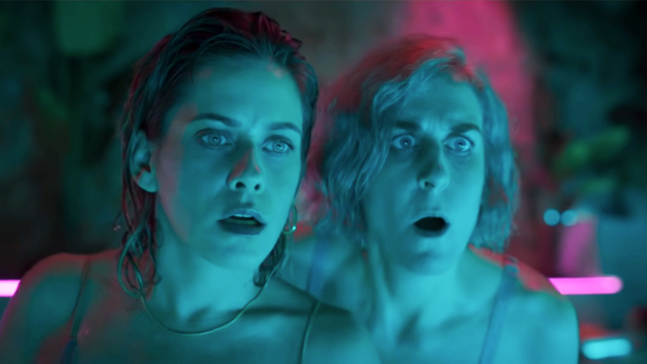 Two women looking shocked in More the Merrier