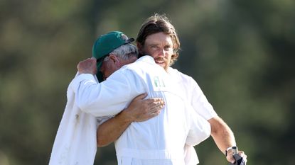 Tommy Fleetwood hugs Gray Moore at the end of the 2024 Masters