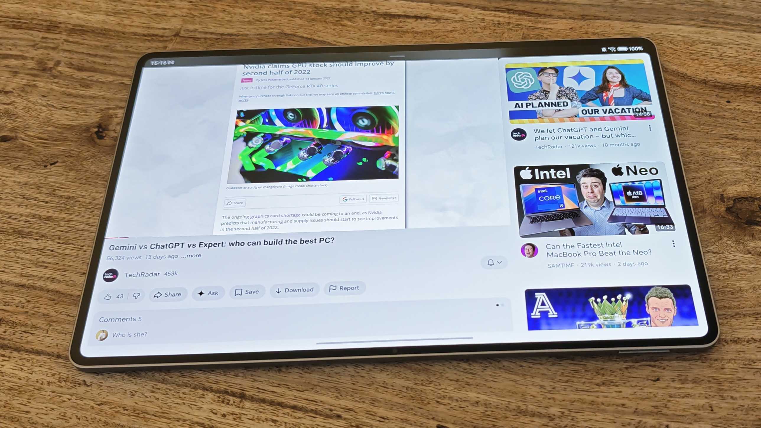 A photograph of the Honor MagicPad 4 in use on a wooden table.