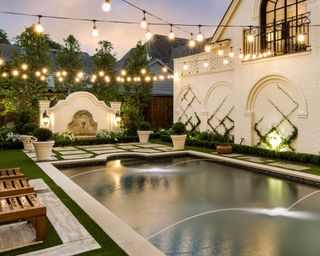 pool lighting ideas with strings of lights above pool