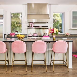 kitchen with pink chair and flower vase
