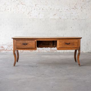 A long wooden writing desk from Magnolia