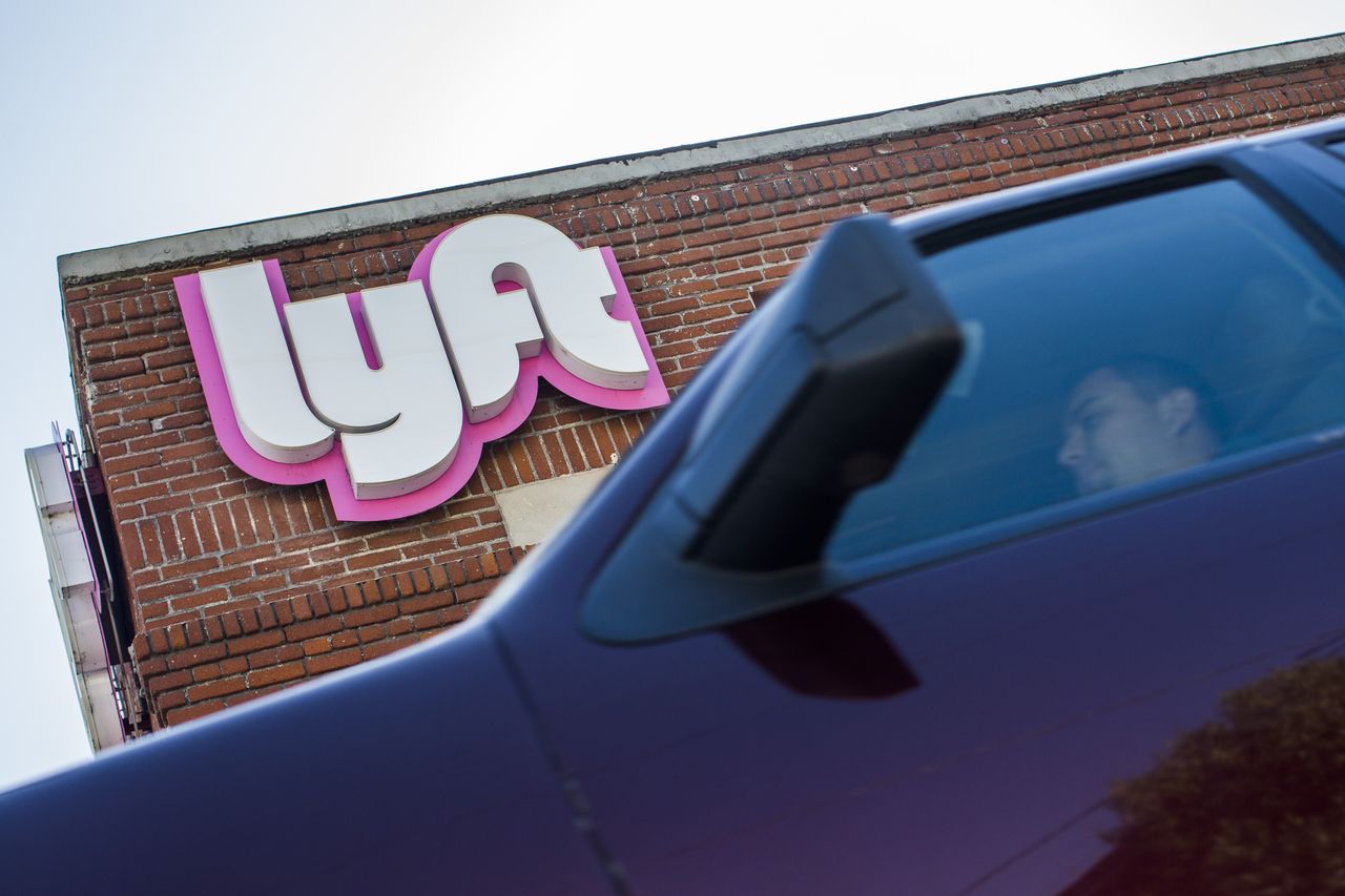 The Lyft logo and a car in LA