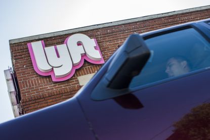 The Lyft logo and a car in LA