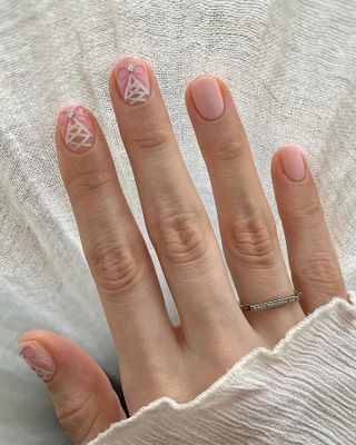 @pink_oblivion light pink bow nail art