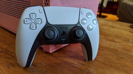 Image of the DualSense controller from the front on in situ.