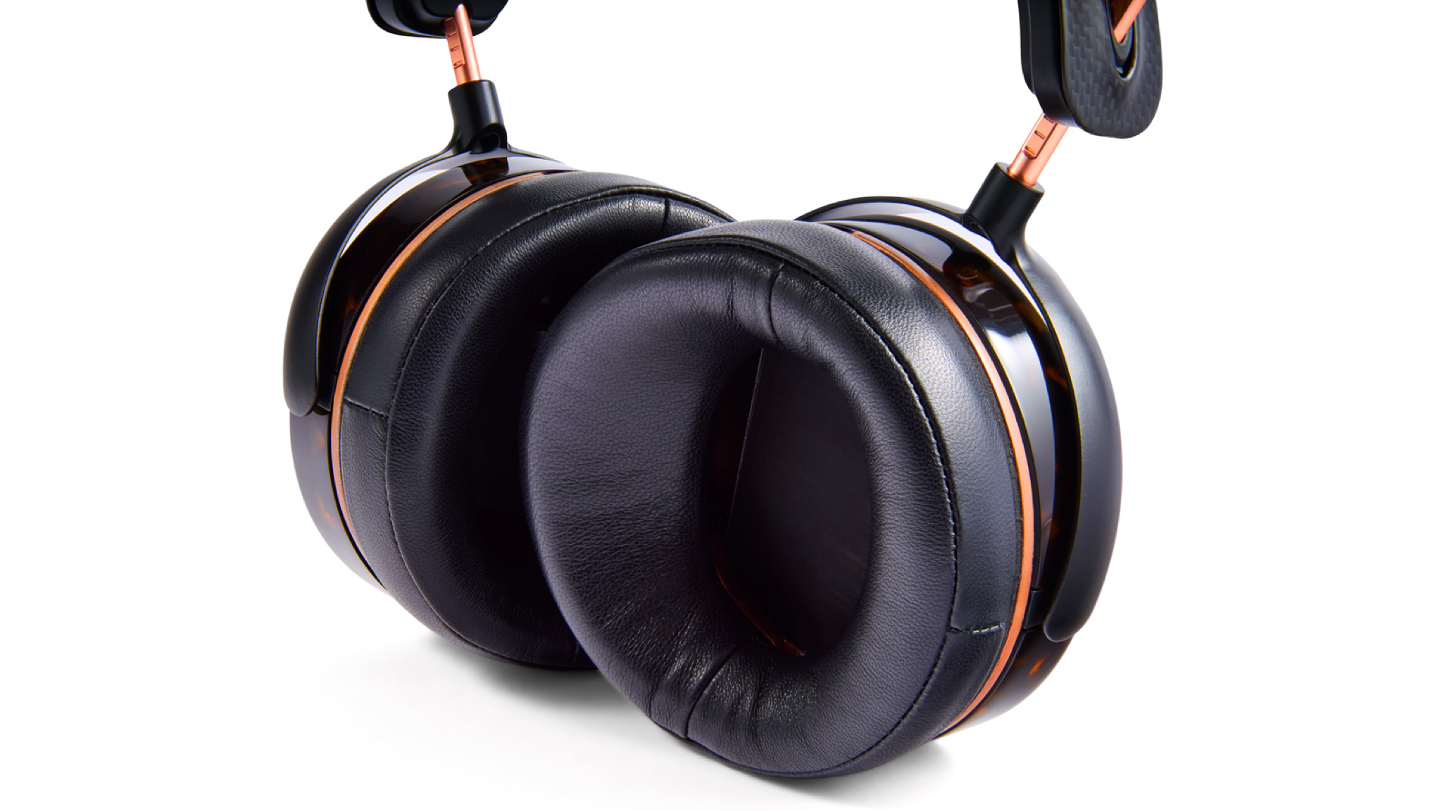 Close-up of the earcups on the Audeze LCD-5s headphones, shot on a white background