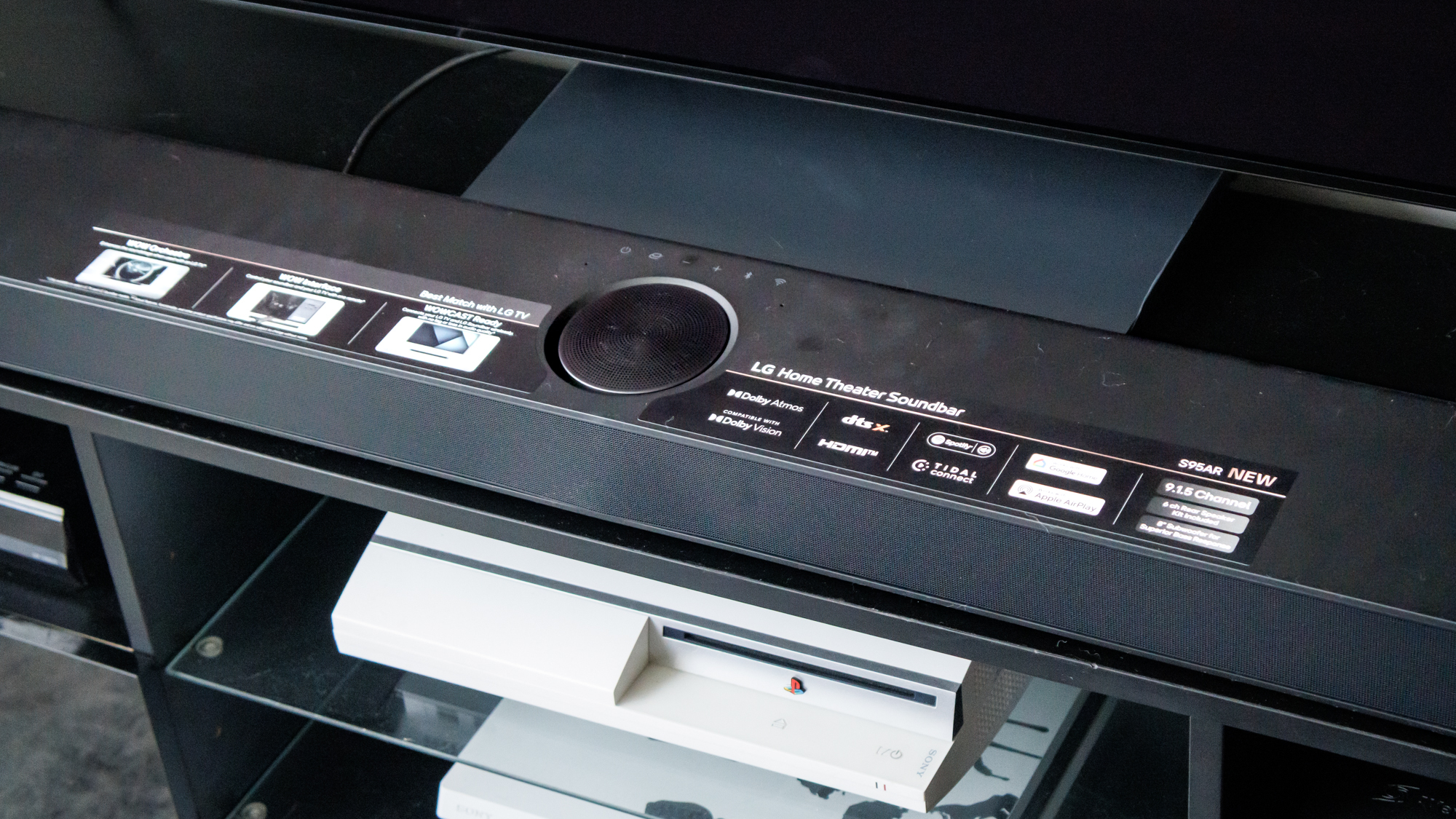 The LG S95AR Soundbar on an entertainment stand.
