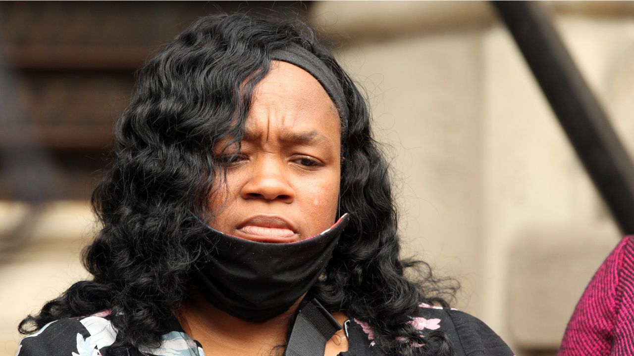 LOUISVILLE, KY - AUGUST 13: Breonna Taylor&#039;s mother Tamika Palmer listens during a press conference over the speed of the investigation of her daughter&#039;s death as attorney Benjamin Crump and co-counsel Lonita Baker addresses the media outside Louisville City Hall on August 13, 2020 in Louisville, Kentucky.The attorneys and family are upset with the lack of action by city officials during the 150 days since Breonna Taylor was fatally shot by Louisville Metro Police officers. (Photo by John Sommers II/Getty Images)