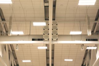 Several Renkus-Heinz speakers hung in the rafters at Pomona College.