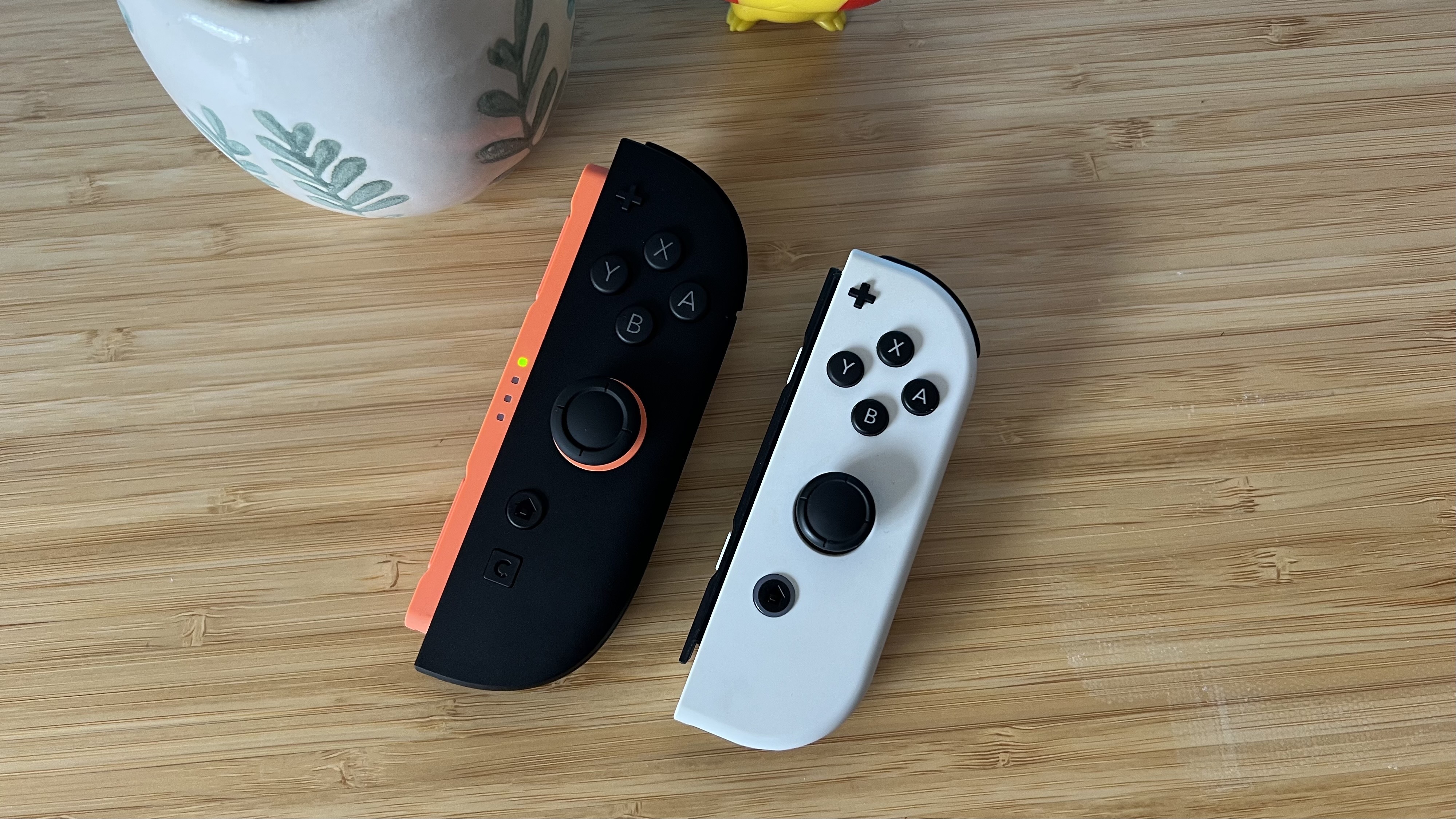 Nintendo Switch 2 Joy-Con next to original Nintendo Switch OLED Joy-Con