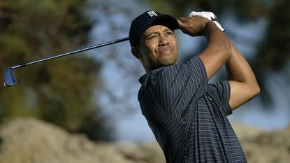 Tiger Woods hits a tee shot on the 15th hole during the third round of the Target World Challenge on December 13, 2003 at the Sherwood Country Club in Thousand Oaks, California