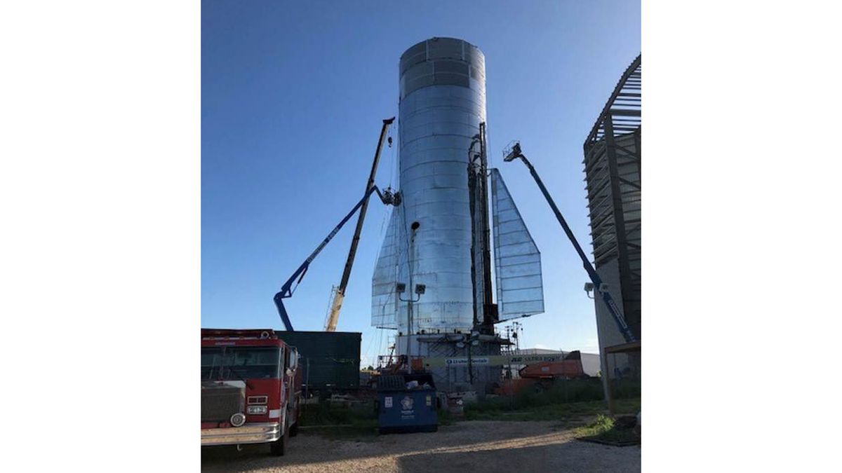 A photo tweeted by SpaceX founder and CEO Elon Musk on Sept. 22, 2019 shows technicians installing stability-controlling rear fins on Starship Mk1.