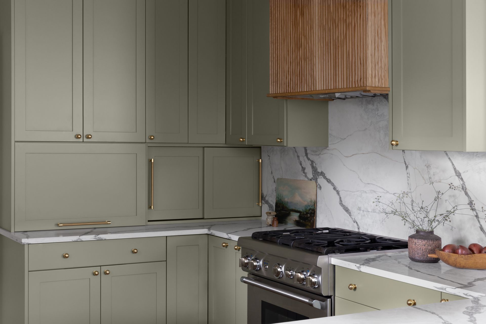 a green grey kitchen with appliance garages