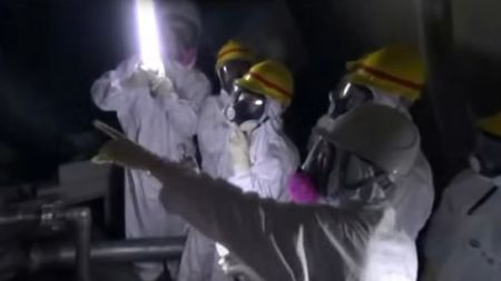 People in hazmat suits inspecting the nuclear powerplant in Fukushima: Nuclear Nightmare