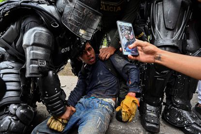 A protester being arrested.