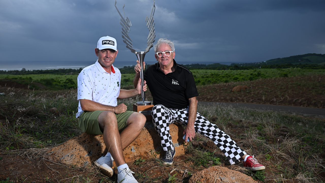 Louis Oosthuizen (left) and Hubert Privé, designer of the Mauritius Open trophy pose after the former&#039;s 2023 win