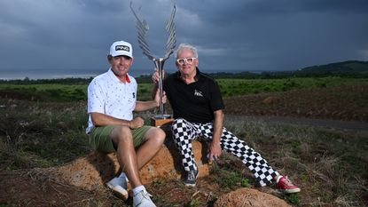 Louis Oosthuizen (left) and Hubert Privé, designer of the Mauritius Open trophy pose after the former's 2023 win